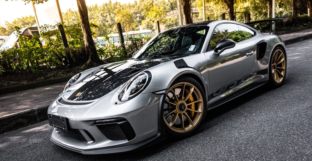 Shanghai, China- August 8,2022: A silver Porsche 911 GT3 RS sportcar is parked in street